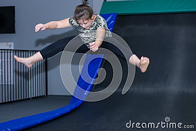 Kids Jumping on Indoor Trampolines makes fun Stock Photo