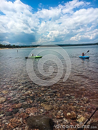 Kids Kayaking on a Lake Stock Photo