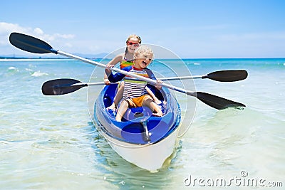 Kids kayaking in ocean. Children in kayak in tropical sea Stock Photo