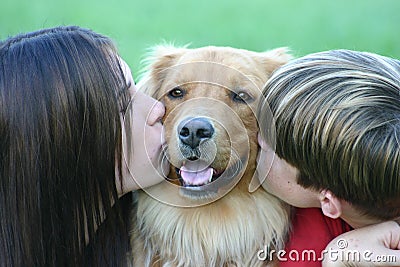 Kids Kissing Dog Stock Photo