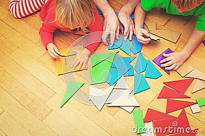 Kids learning -little boy and girl playing with geometric shapes Stock Photo