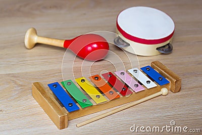 Kids Musical instrument. Xylophone, maraca and tambourine. Colorful toys Stock Photo