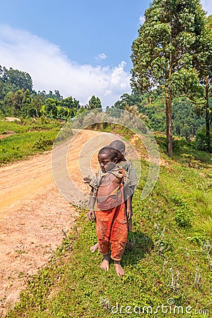 Kids in old ragged clothes in a rural area, Lake Mutanda, Uganda. Editorial Stock Photo