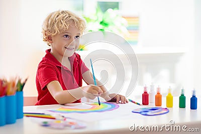 Kids paint. Child painting. Little boy drawing Stock Photo