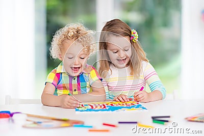 Kids paint and draw at home Stock Photo