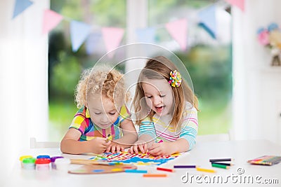 Kids paint and draw at home Stock Photo