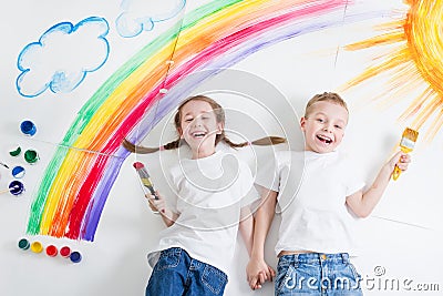 Kids painting rainbow Stock Photo