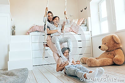 Kids paljamas party in white bedroom interior Stock Photo