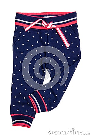 Kids pants isolated. A stylish fashionable dark blue denim trousers with white dots for the little girl. Children sport trousers Stock Photo