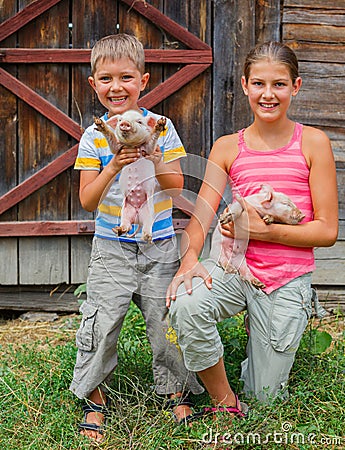 Kids with piglet Stock Photo