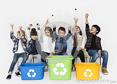 Kids and plastic bottles in a recycle bin Stock Photo