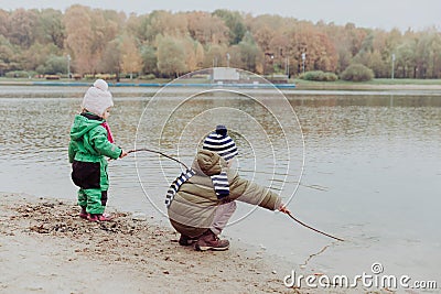 Kids play in autumn nature Stock Photo