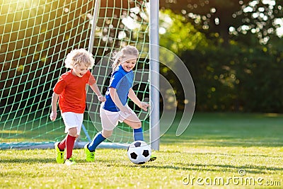 Kids play football. Child at soccer field. Stock Photo