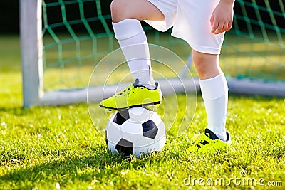 Kids play football. Child at soccer field. Stock Photo