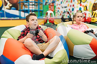 Kids play in a games console, happy childhood Stock Photo