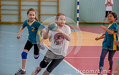 Kids play handball indoor. Sports and physical activity. Training and sports for children Editorial Stock Photo