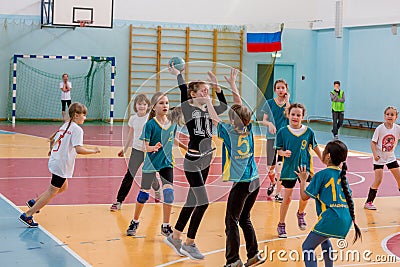 Kids play handball indoor. Sports and physical activity. Training and sports for children Editorial Stock Photo