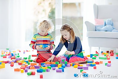 Kids play with toy blocks. Toys for children. Stock Photo