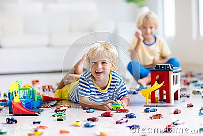 Kids play with toy cars. Children playing car toys Stock Photo