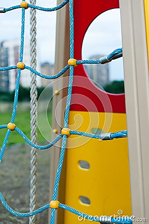 Kids Playground Safety Color Net. Texture of yhe Mesh Fence on the Playground Stock Photo