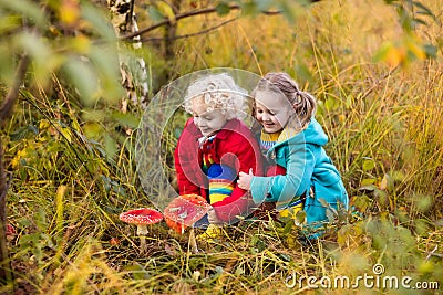 Kids playing in autumn forest Stock Photo