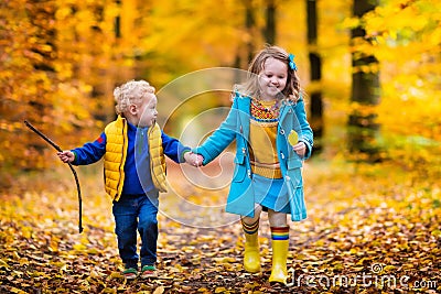Kids playing in autumn park Stock Photo