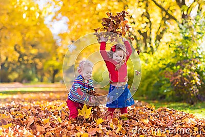 Kids playing in autumn park Stock Photo