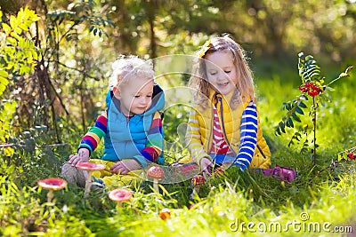 Kids playing in autumn park Stock Photo