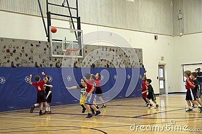 Kids playing basketball match Editorial Stock Photo