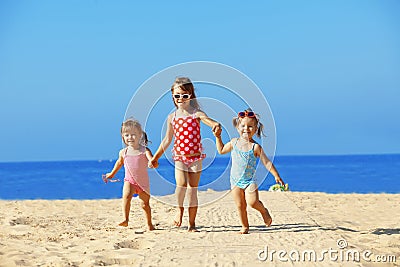 Kids playing at the beach Stock Photo