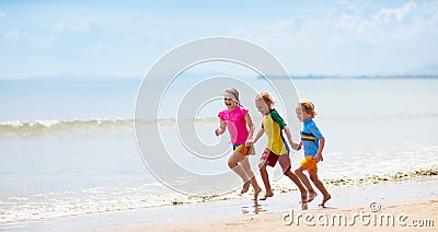 Kids playing on beach. Children play at sea Stock Photo