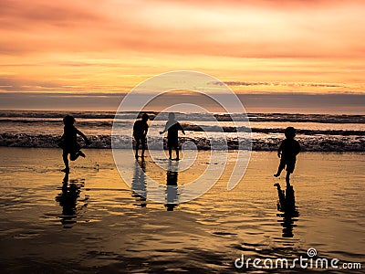 Kids playing on beach Stock Photo