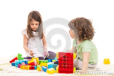 Kids playing with bricks toys Stock Photo