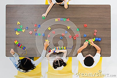 Kids playing colorful toys Stock Photo