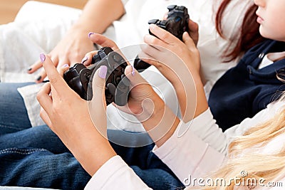 Kids playing console games using joystick Stock Photo