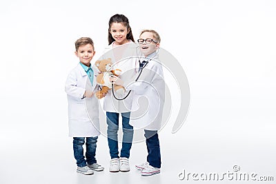 Kids playing doctors Stock Photo