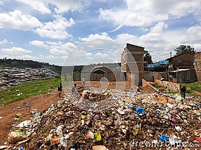 Kids playing on a dump field in Kibera slums Editorial Stock Photo