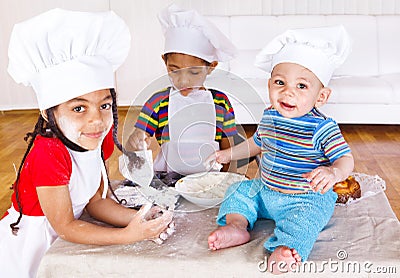 Kids playing with flour Stock Photo