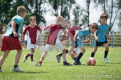 Kids playing football Stock Photo