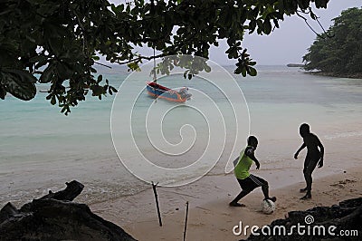 Kids playing football at Winnifred beach Editorial Stock Photo