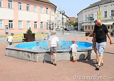 Kids playing on fountain Editorial Stock Photo