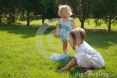 Kids playing on green grass Stock Photo