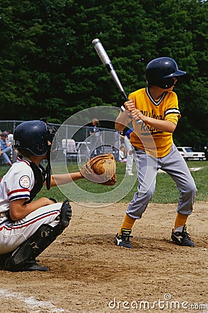 Kids playing in a little league baseball game Editorial Stock Photo