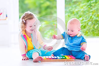 Kids playing music with xylophone Stock Photo