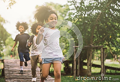 Kids playing outdoors Stock Photo