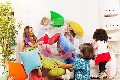 Kids playing pillow fight Stock Photo