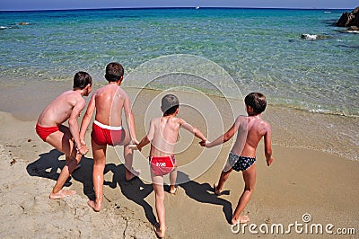 Kids playing on the Scoglio di Peppino beach Editorial Stock Photo