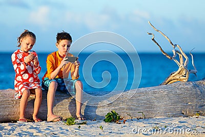 Kids playing on smartphone Stock Photo