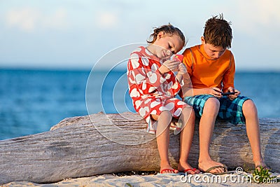 Kids playing on smartphone Stock Photo