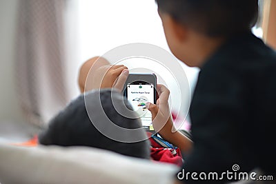 Kids playing smartphone Stock Photo